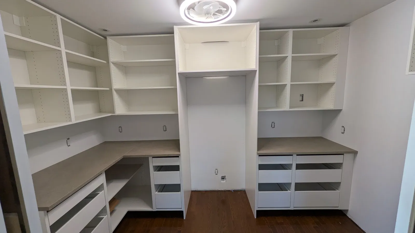 Walk-in pantry in Laval with IKEA SEKTION open shelving, drawer cabinets and a taupe countertop